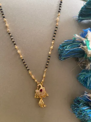 Artificial American Diamond Short Gold Mangalsutra Designs Peacock Pendant Gold & Black Beads Chain