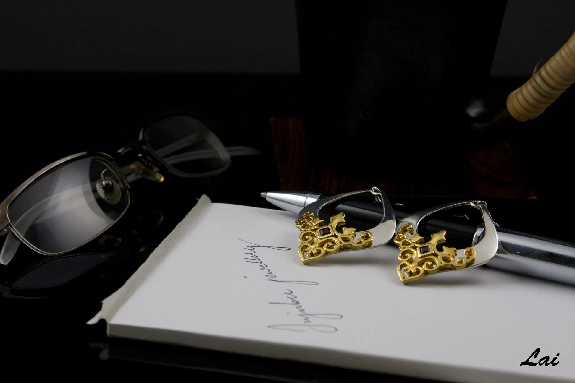 Gorgeous, kite-shape earrings with garnet and gold plated detailing