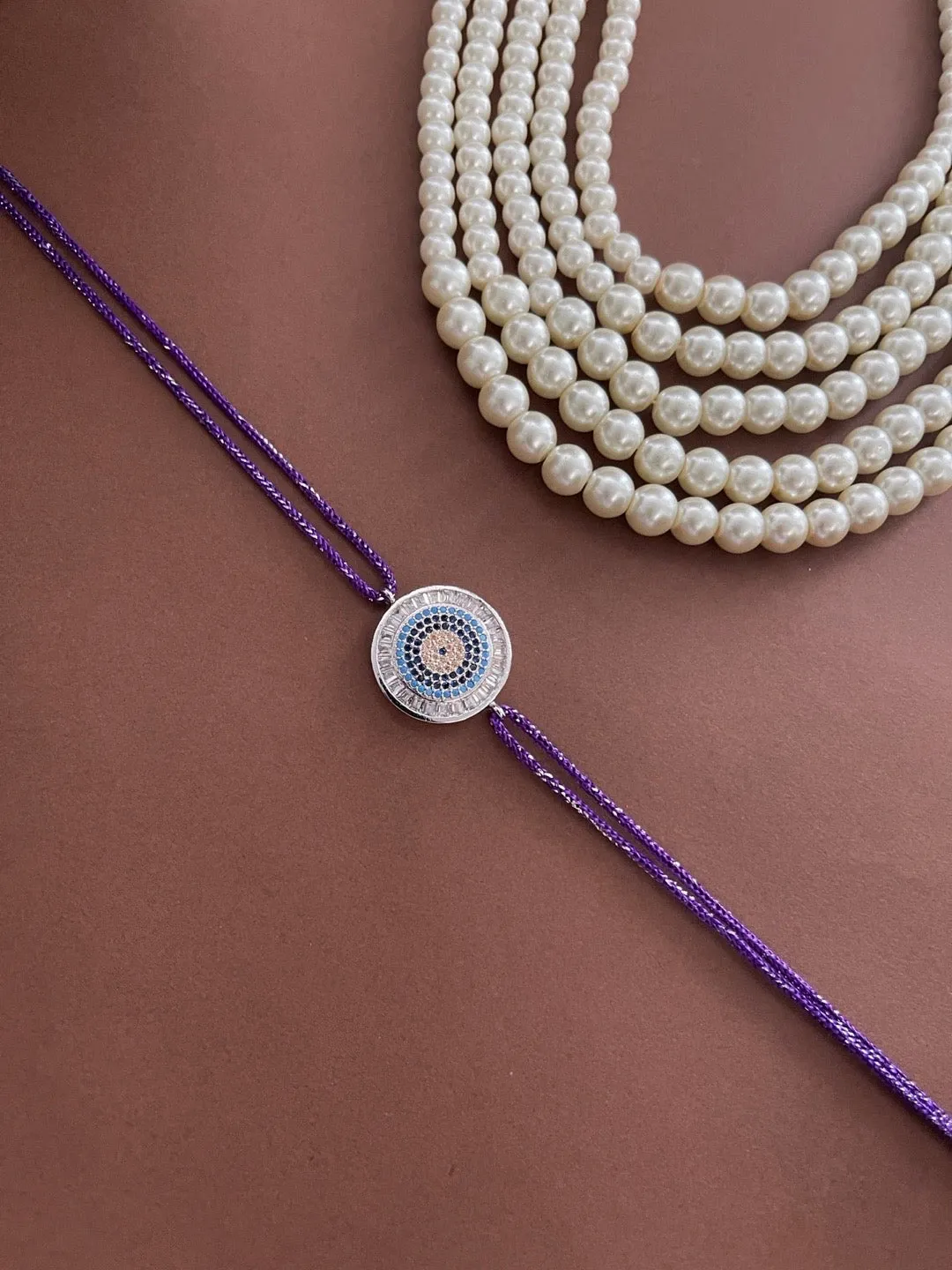 Latest American Diamond Round Evil Eye Rakhi With Purple Thread Rakhi For Rakshabandhan