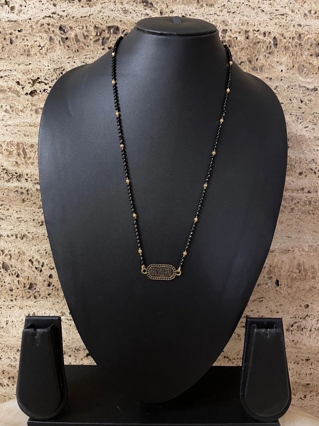Modern Simple Trendy Short Mangalsutra Designs Om Swastik Pendant Gold And Black Beads Chain