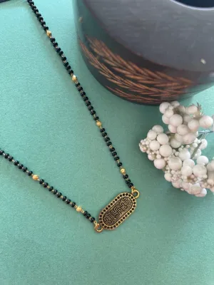 Modern Simple Trendy Short Mangalsutra Designs Om Swastik Pendant Gold And Black Beads Chain