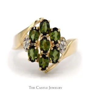 Oval Tsavorite Garnet and Diamond Cluster Ring With .01 CTTW in Bypass Style 10 KT Yellow Gold