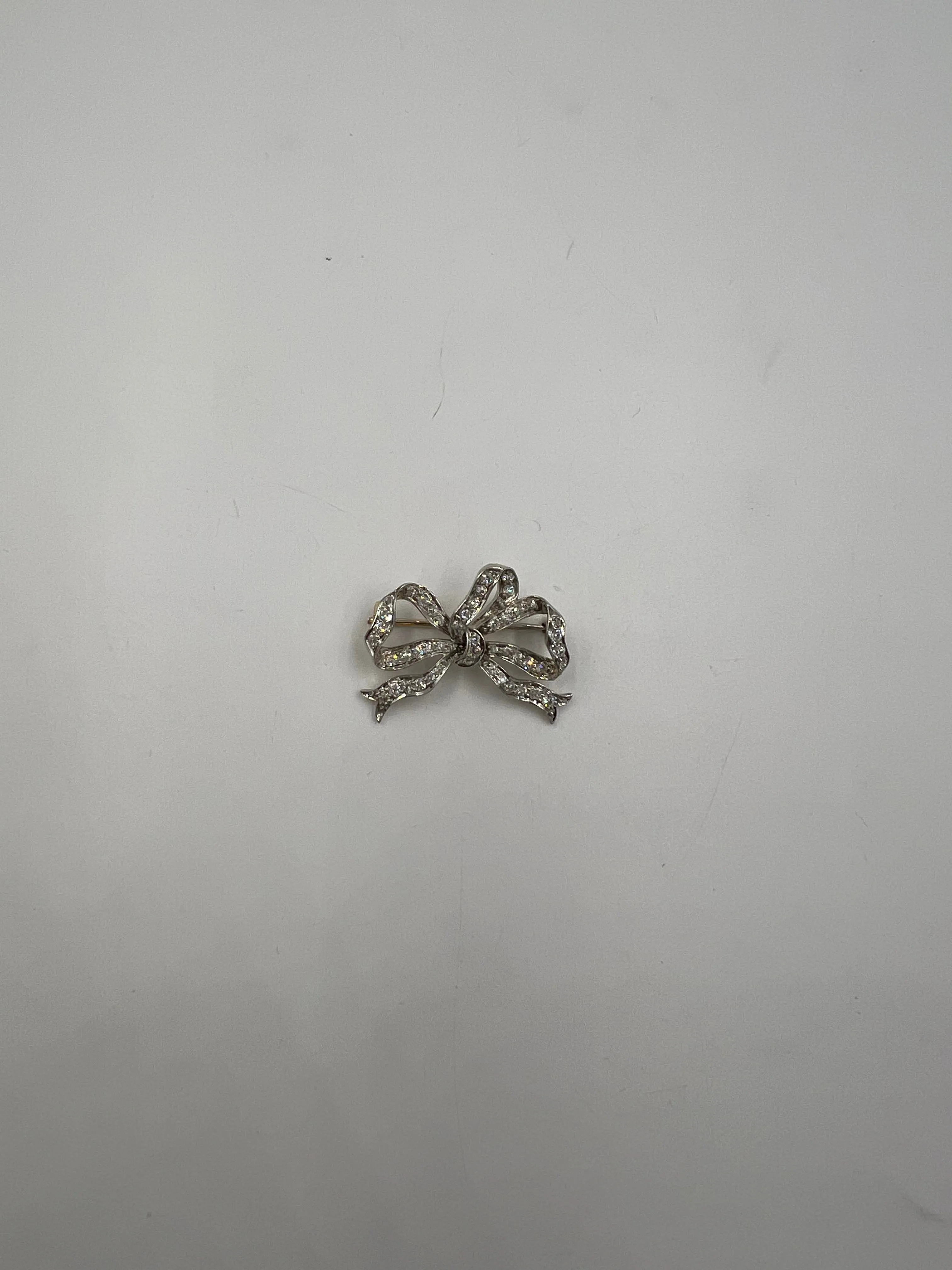 Tiffany Edwardian Old Mine Cut Diamond Platinum And 18k Gold Bow Brooch Circa 1910